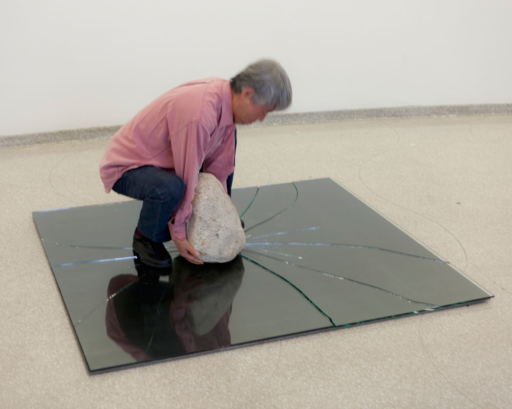 Lee Ufan breaking the glass for&nbsp;Relatum (formerly Phenomena and Perception B) (1968/2011), during installation of Lee Ufan: Marking Infinity,&nbsp;Solomon R. Guggenheim Museum, New York